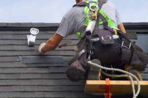 roofer repairing roof